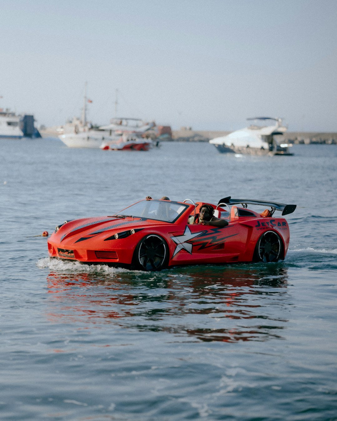 Car-shaped jet ski on the water